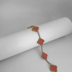 Bracelet doré trèfles émaillés rose corail