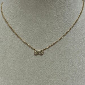 Collier nœud doré pavé de strass